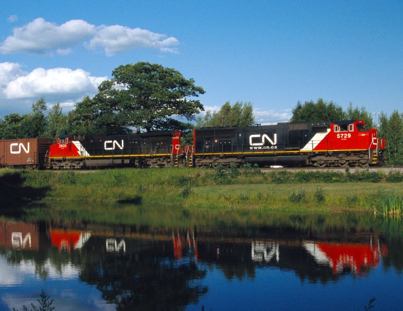 CN Media File two engines in front of a lake CN Media File two engines in front of a lake