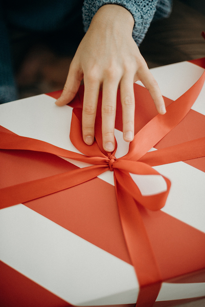 Big_red_and_white_striped_gift_with_red_bow.jpg