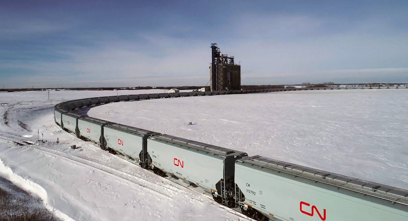 CN Grain cars pulling through filling station